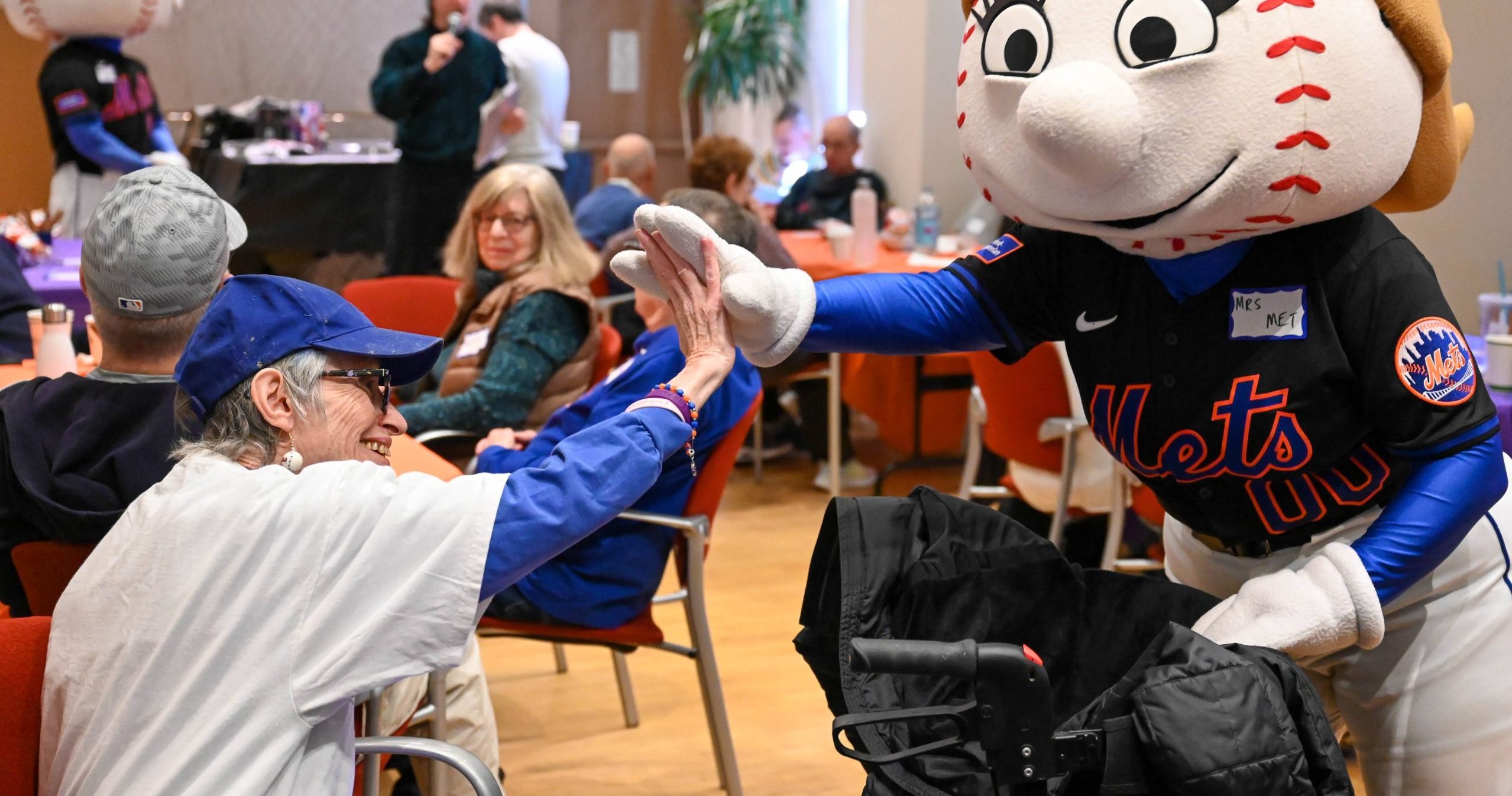 Fun moments at a Sports Trivia event for older adults.