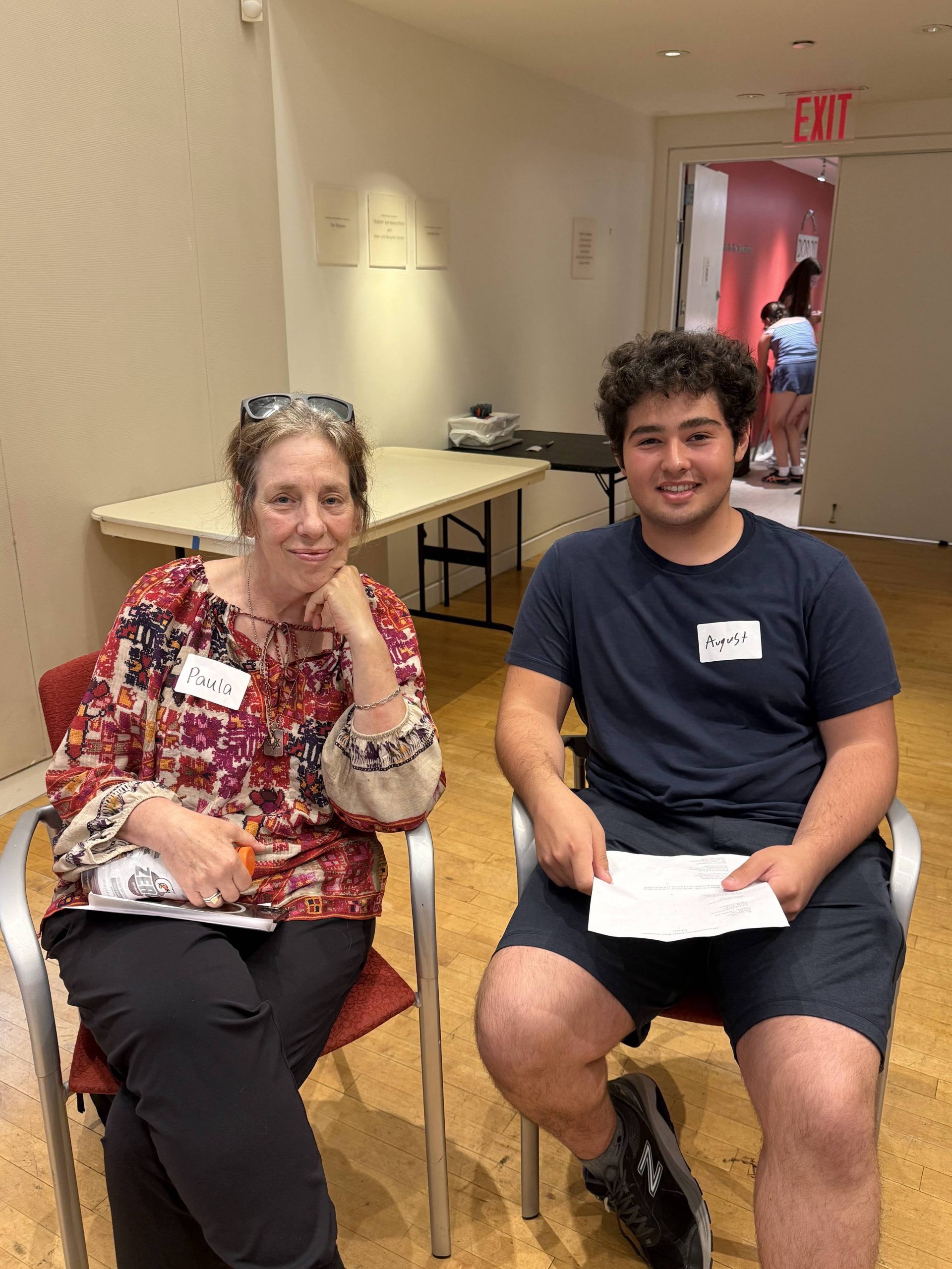 Teen intern and older adult enjoying a program together.