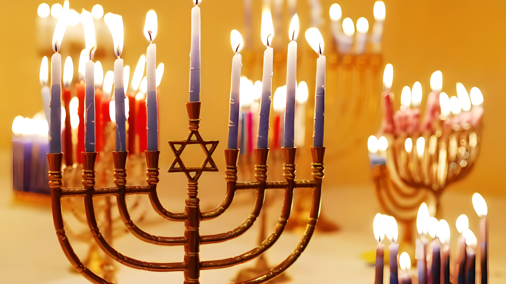 Picture of Menorah with all the light blue candles lit.