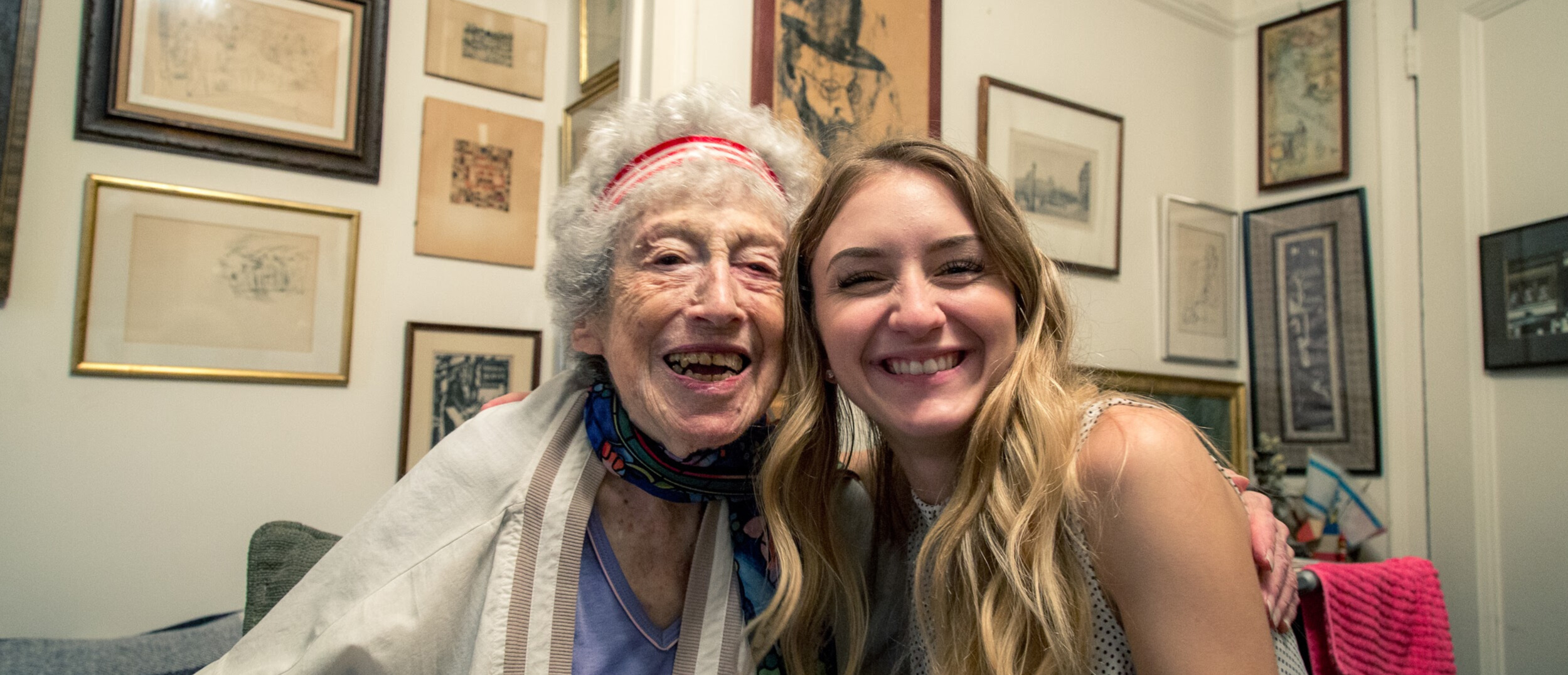 a DOROT participant and young volunteer smiling together